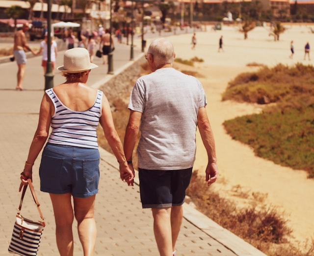 An active senior couple talking a walk.